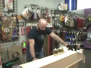 Muscle bear goes to adult shop